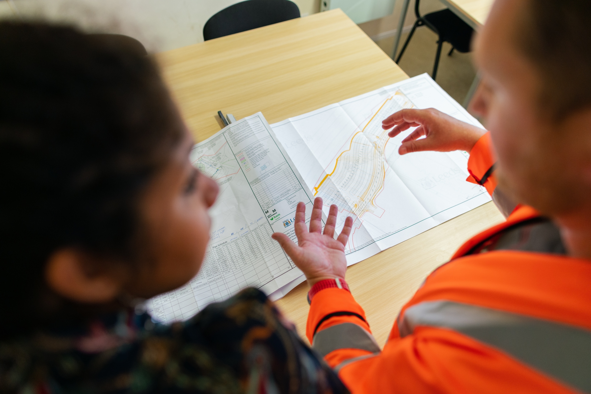 How can AI help reduce construction costs?